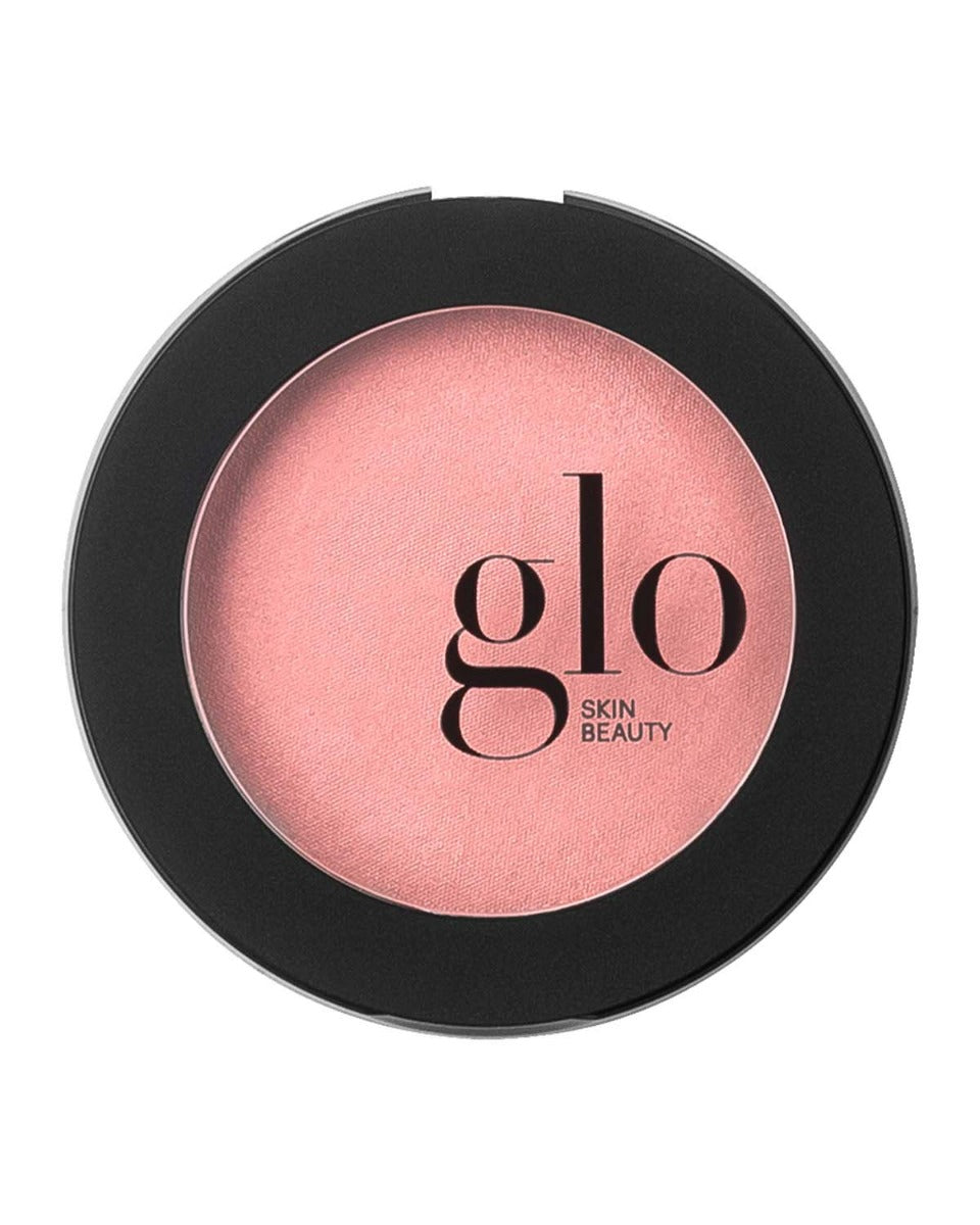 Pink blush compact with 'glo SKIN BEAUTY' brand name