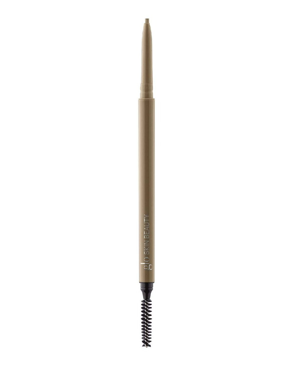 Retractable taupe eyebrow pencil with spoolie, labeled glo SKIN BEAUTY.