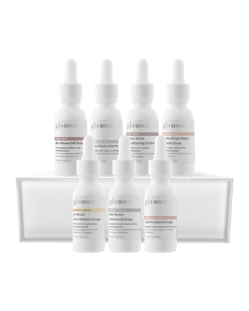 glo SKIN BEAUTY bottles: Bio-Renew EGF Drops; C-Shield Anti-Pollution Drops; HA-Revive Hyaluronic Drops; GlyPro Retinol Drops