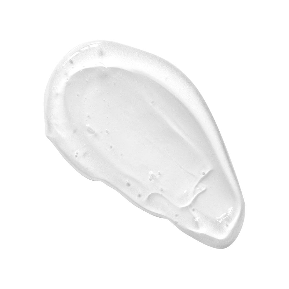 White cosmetic cream smear, glossy texture with small air bubbles and smooth brushstroke