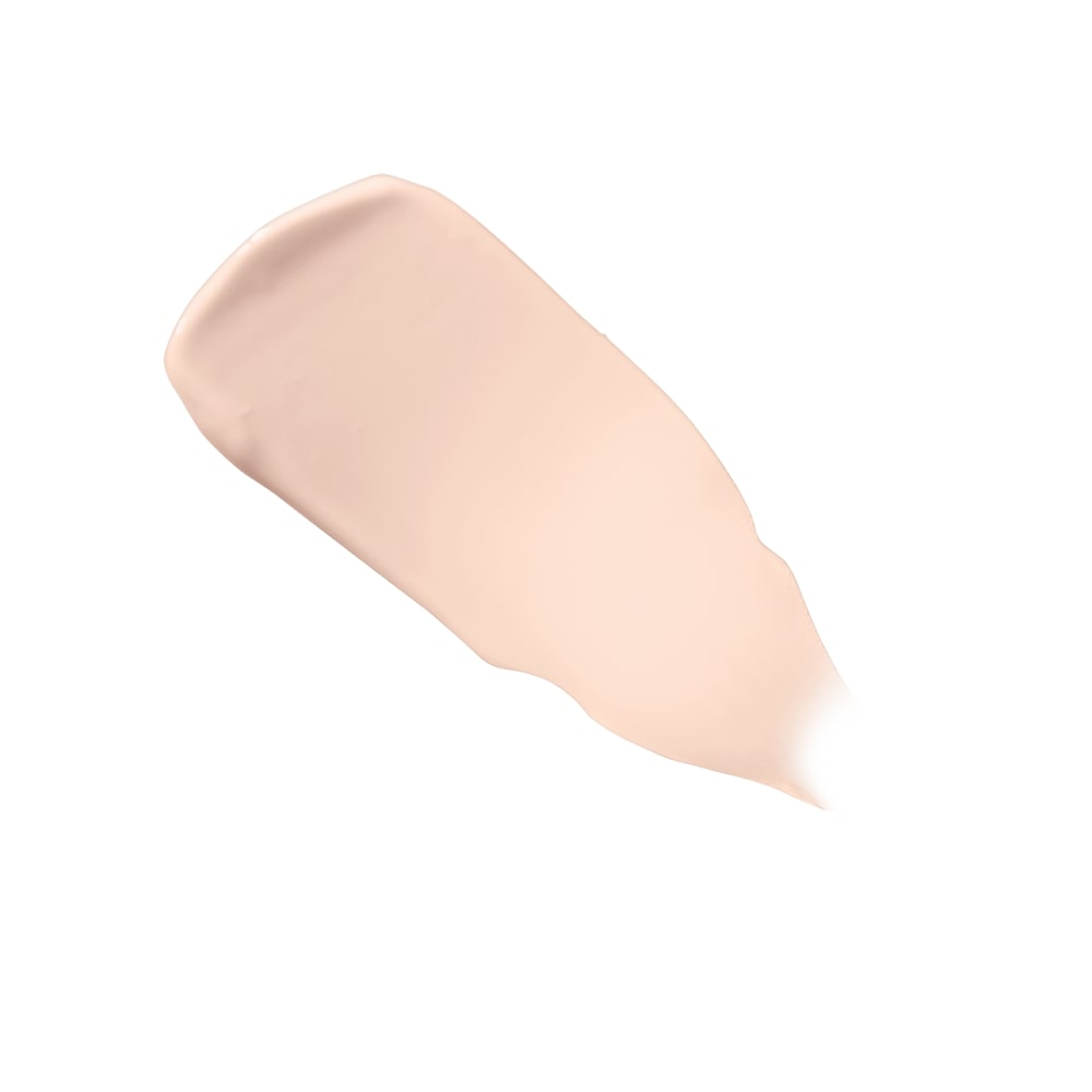 Swatch of light beige liquid foundation smeared on a white background