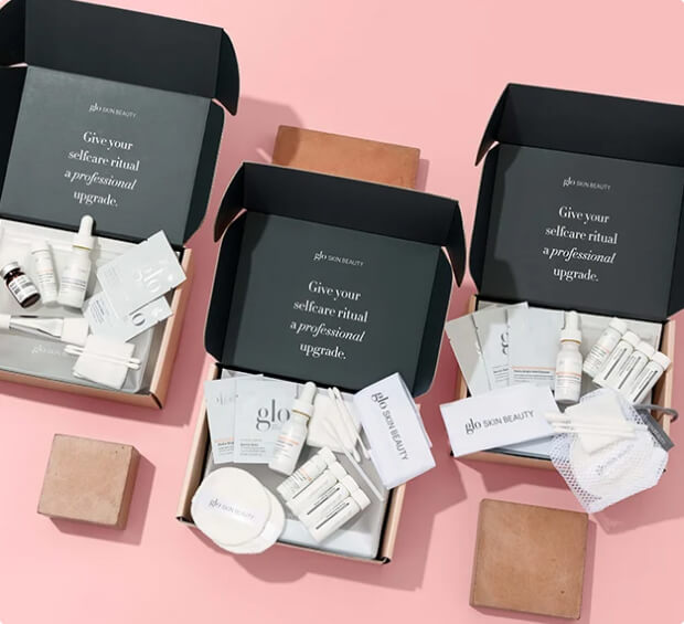 Open glo SKIN BEAUTY boxes with samples; text: 'Give your selfcare ritual a professional upgrade.'
