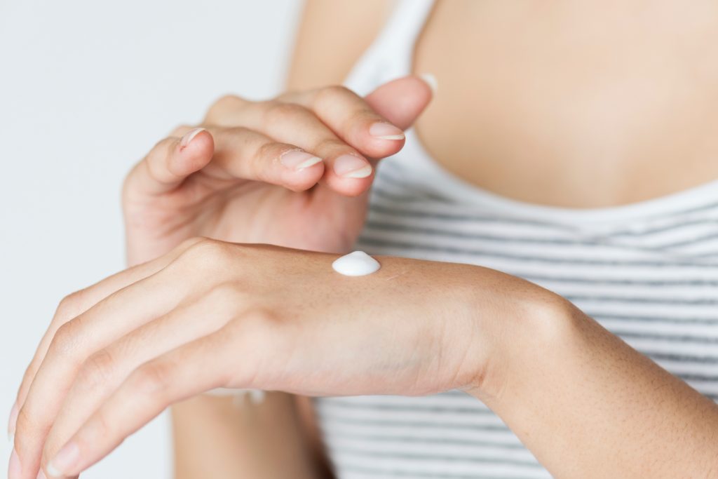 close up of lotion on back of hand