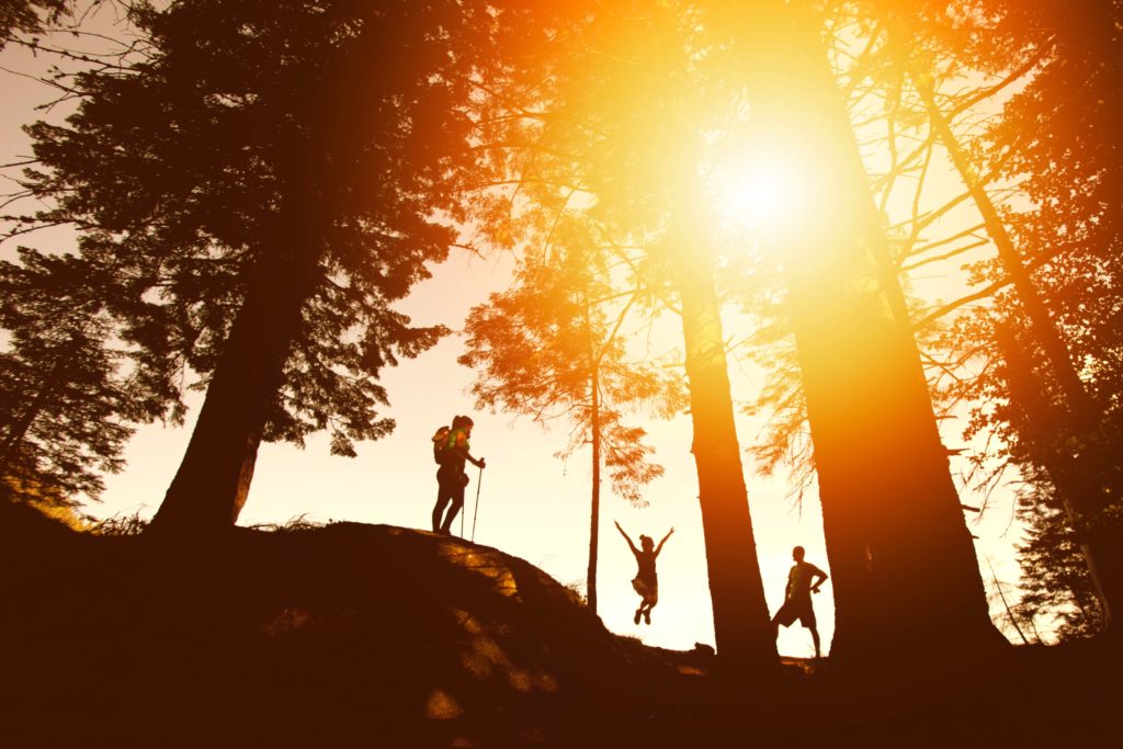 People hiking outdoors in the sun