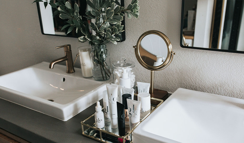 Wedding day makeup and skincare products on sink