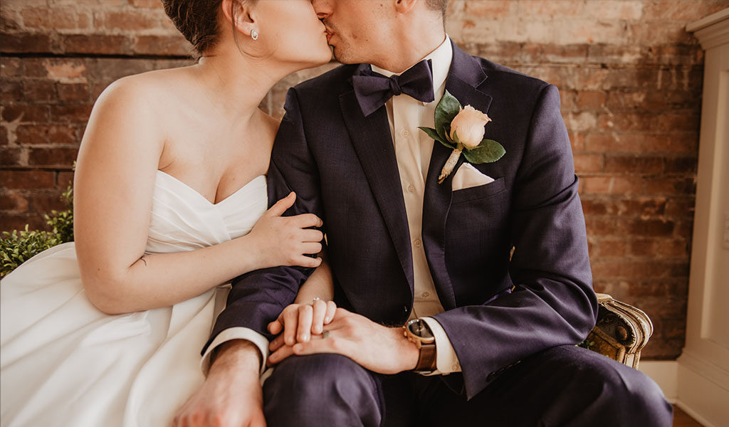 Bride and groom kissing