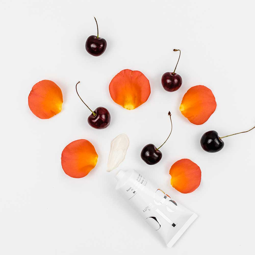 glo skin beauty product with cherries & petals