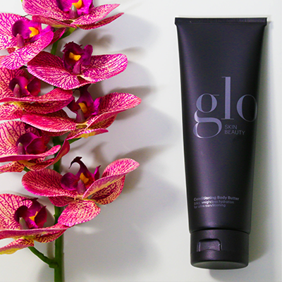 glo skin beauty product next to flowers