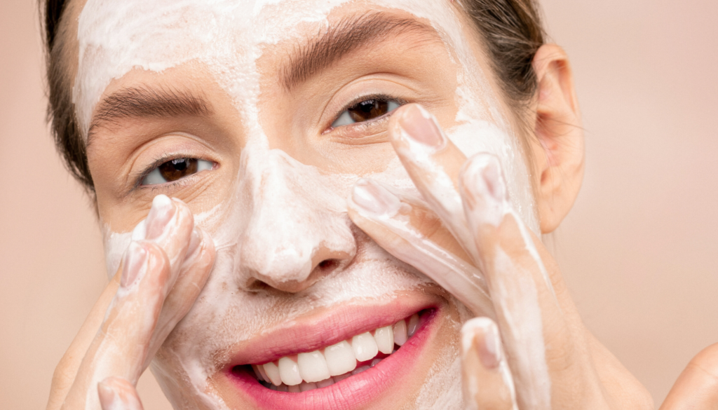 woman washing her face