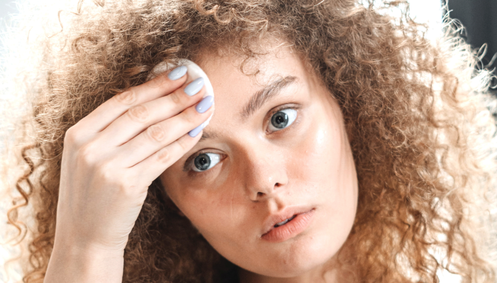 woman applying product to forehead