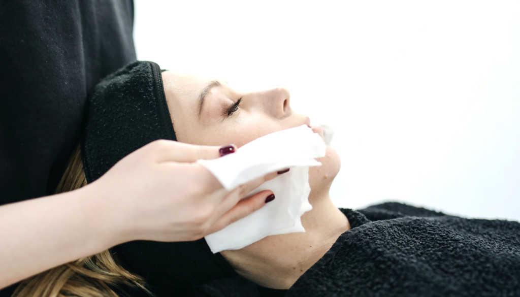 woman getting a facial at a spa