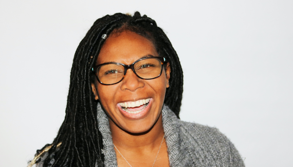 woman with glasses laughing