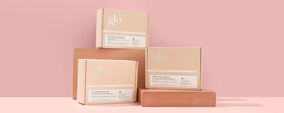 glo boxes labeled 'GlyPro AHA Resurfacing Peel', 'Retinol + C Smoothing Peel', 'Hydra-Bright AHA Glow Peel'