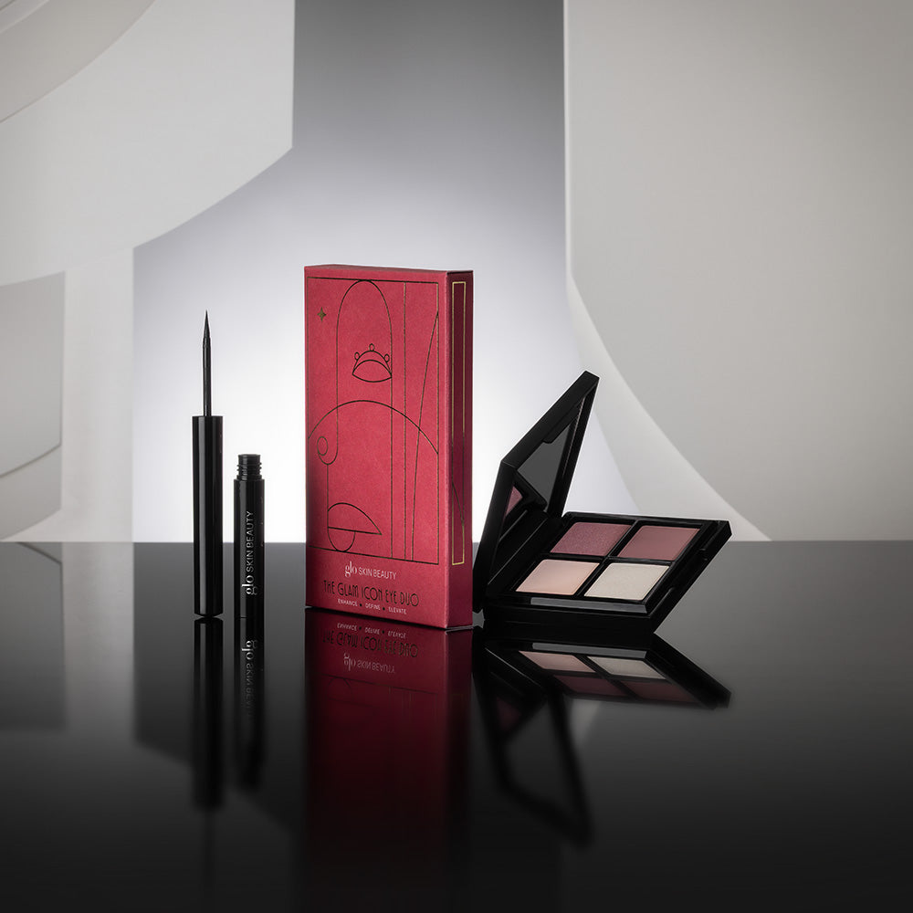 Front view of The Glam Icon Eye Duo showcasing a four-shade palette and liquid eyeliner with a gray geometric backdrop
