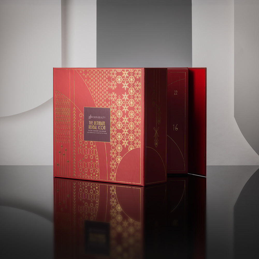 Front view of The Ultimate Reveal Icon 24 day advent calendar showing numbered doors against a dark reflective background