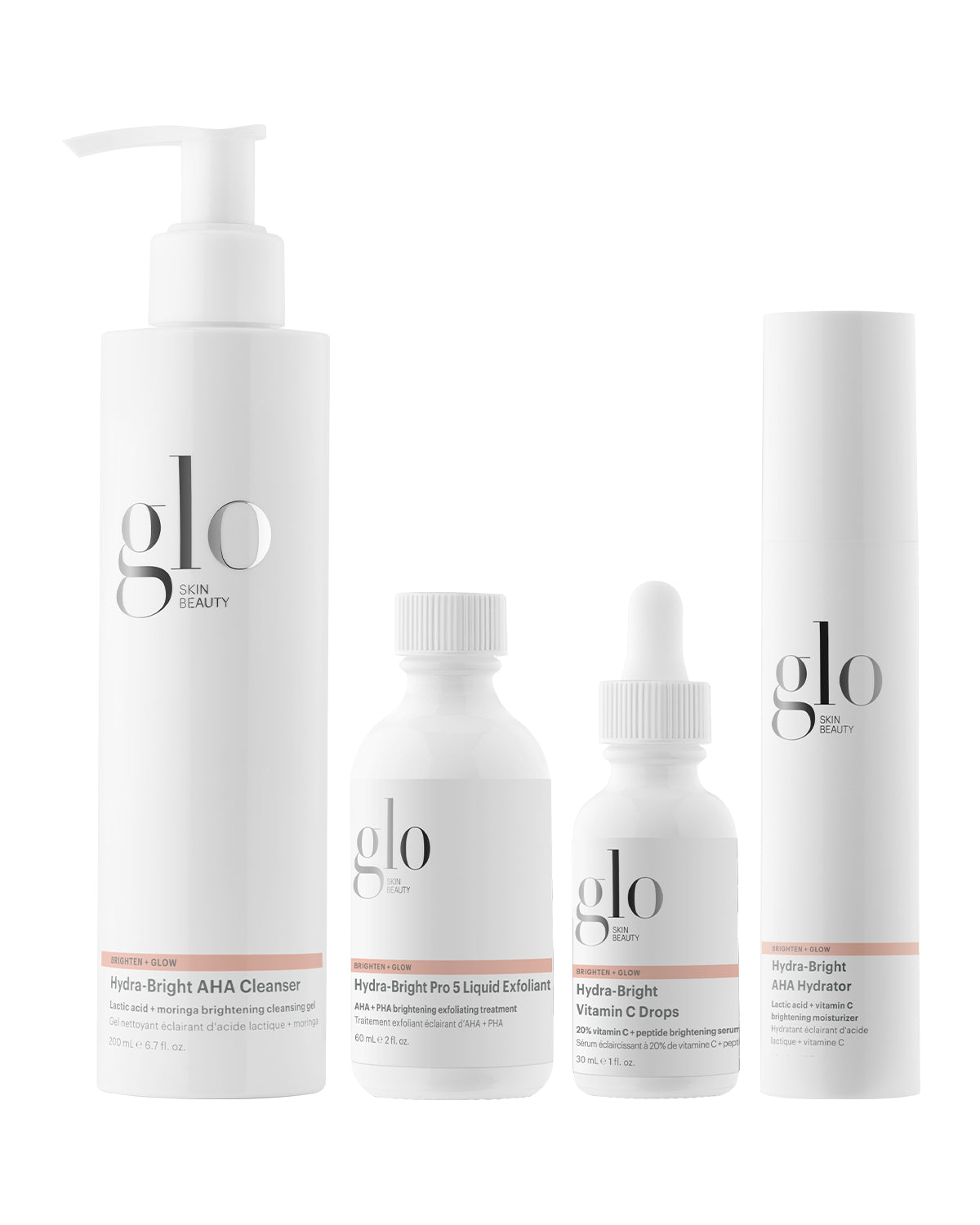 Four white Glo Skin Beauty bottles — Hydra-Bright AHA Cleanser; Hydra-Bright Pro 5 Liquid Exfoliant; Hydra-Bright Vitamin C Drops; Hydra-Bright AHA Hydrator.