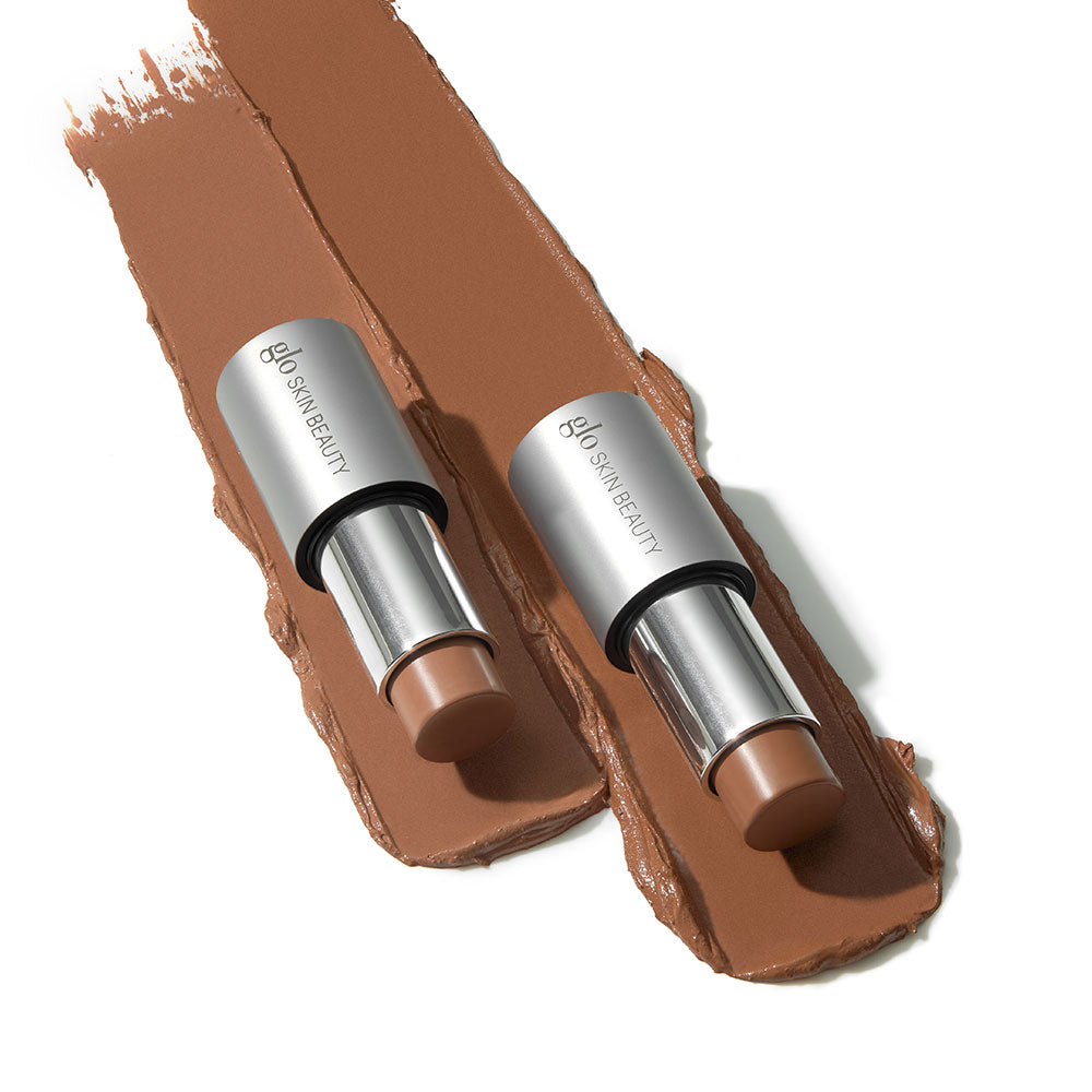 Two glo SKIN BEAUTY  Cream Bronze Stick shades on brown swatches