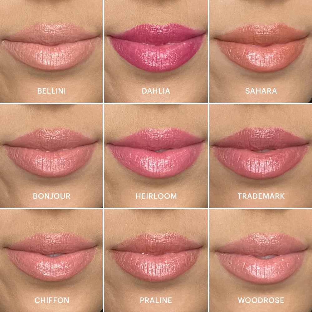 Nine lip crayon swatches labeled BELLINI, DAHLIA, SAHARA, BONJOUR, HEIRLOOM, TRADEMARK, CHIFFON, PRALINE, WOODROSE
