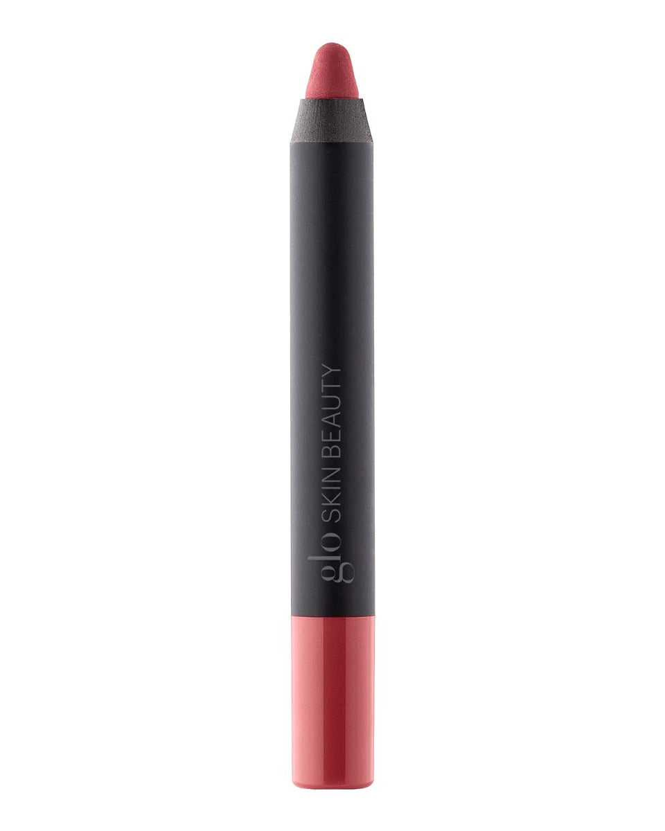 Front view of Suede Matte Crayon showing red tip and matte black barrel with glo SKIN BEAUTY logo on white background