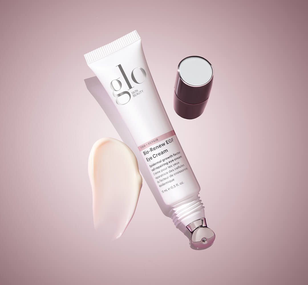 Tube of Glo Skin Beauty Bio-Renew EGF Eye Cream with applicator and cream smear