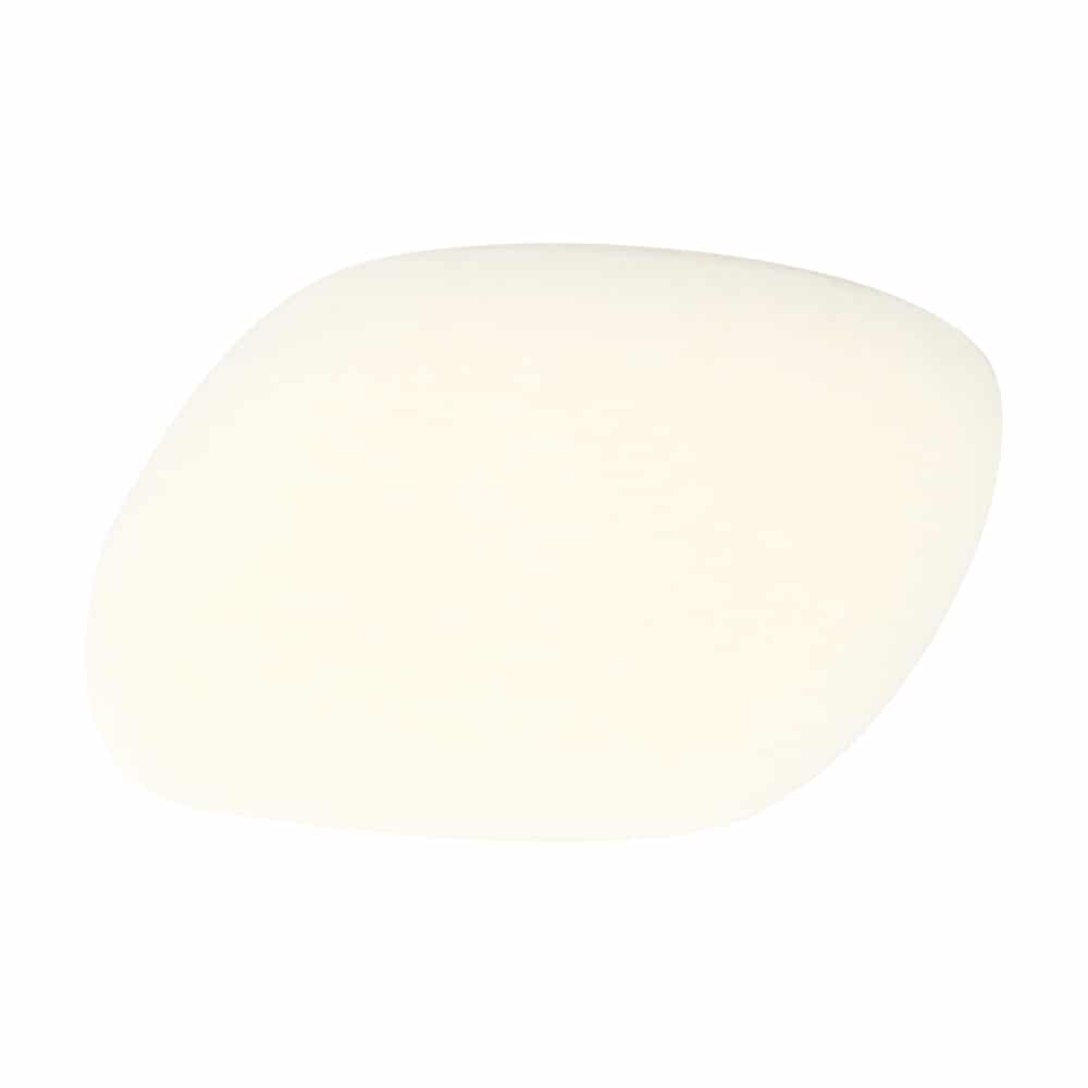 Rounded organic-shaped white foundation sponge with pebble-like form on white background.
