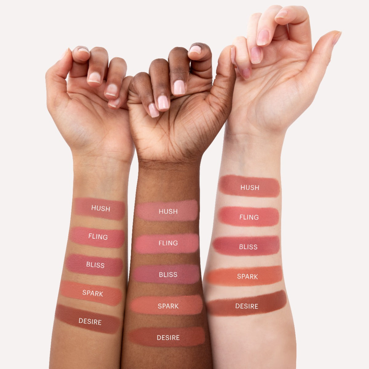 Swatches of five cream blush shades labeled HUSH, FLING, BLISS, SPARK, and DESIRE on three different skin tones.