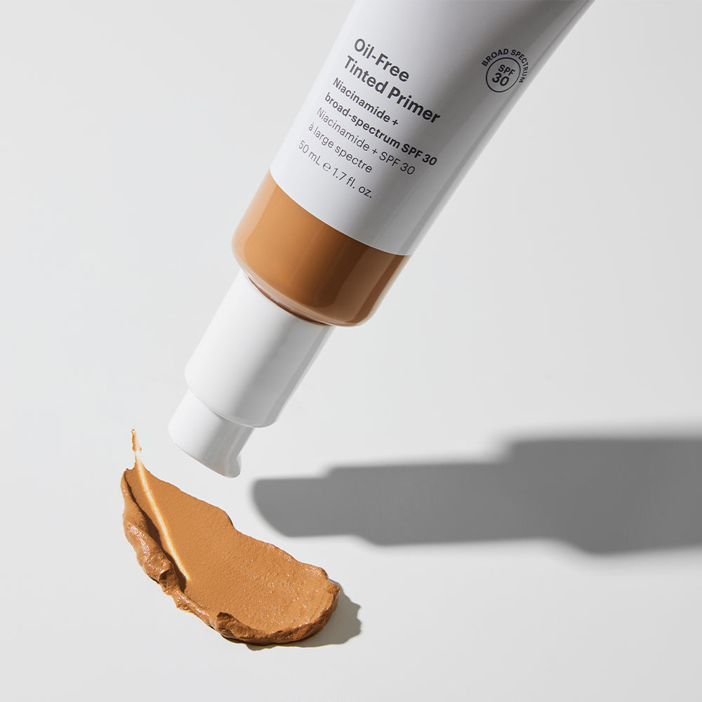 Tube of Oil-Free Tinted Primer SPF 30 with Niacinamide dispensing tinted primer swatch