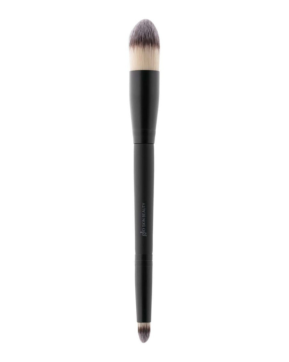 Dual-ended makeup brush with black handle and bristles, labeled 'Glo SKIN BEAUTY'