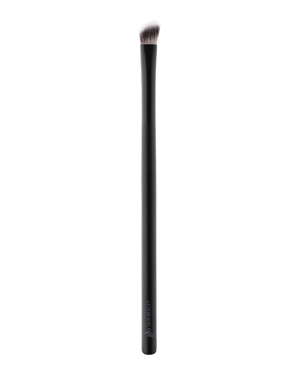 Angled small eyeshadow brush with black handle labeled glo SKIN BEAUTY