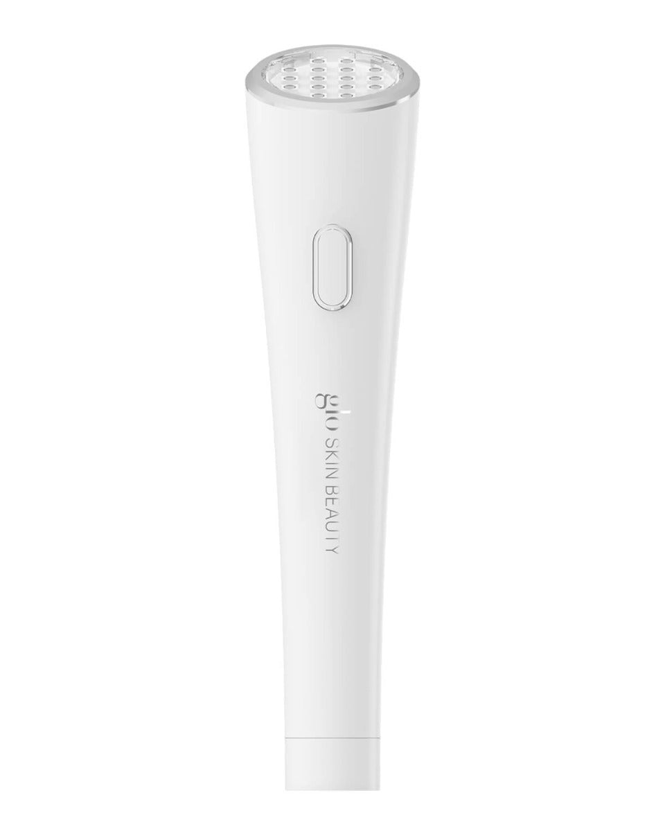 White handheld anti-aging LED spot device with single button, branded 'glo SKIN BEAUTY'.