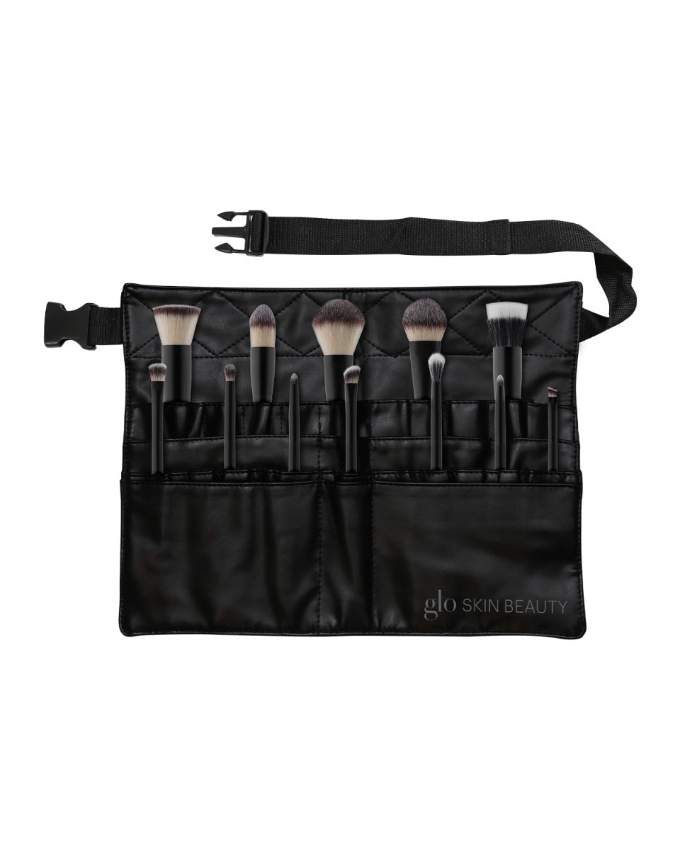 Black brush belt holding makeup brushes with adjustable strap; 