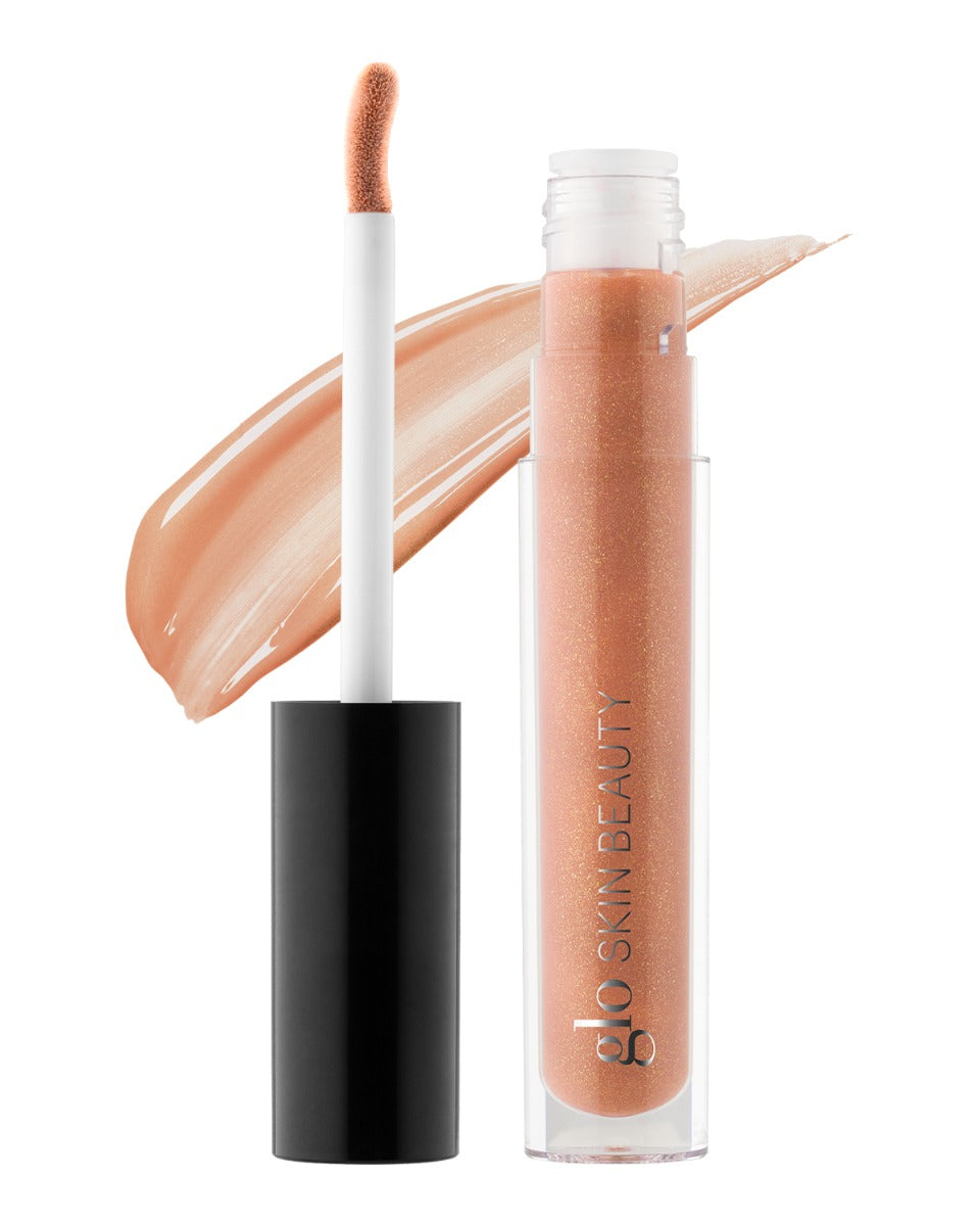 Peachy-nude glitter lip gloss tube with doe-foot applicator and swatch, labeled glo SKIN BEAUTY.