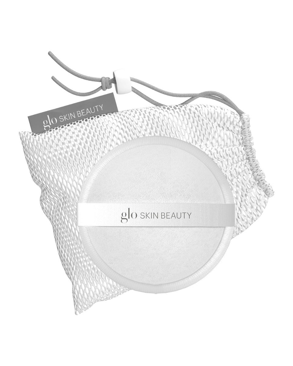 Round reusable makeup remover pad with glo SKIN BEAUTY band and mesh drawstring pouch