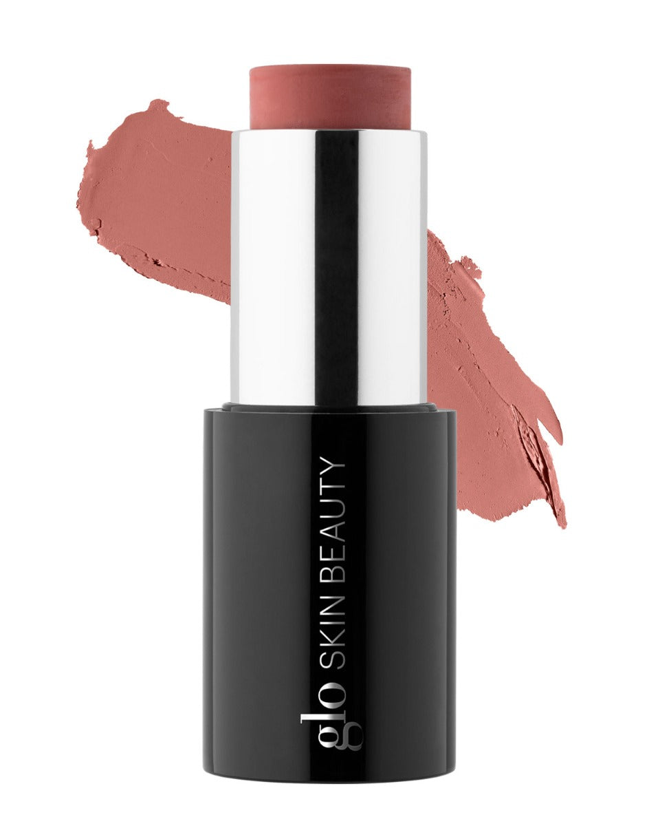 glo SKIN BEAUTY cream blush stick, muted rose shade with matching swatch behind product