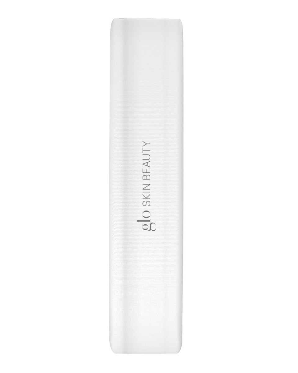 White headband with vertical 'glo SKIN BEAUTY' logo centered on the surface.