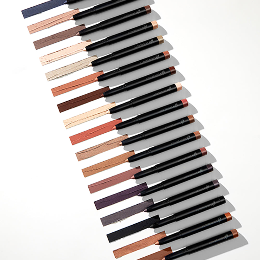 Diagonal row of cream eye pencils and liners in assorted neutral and warm shades
