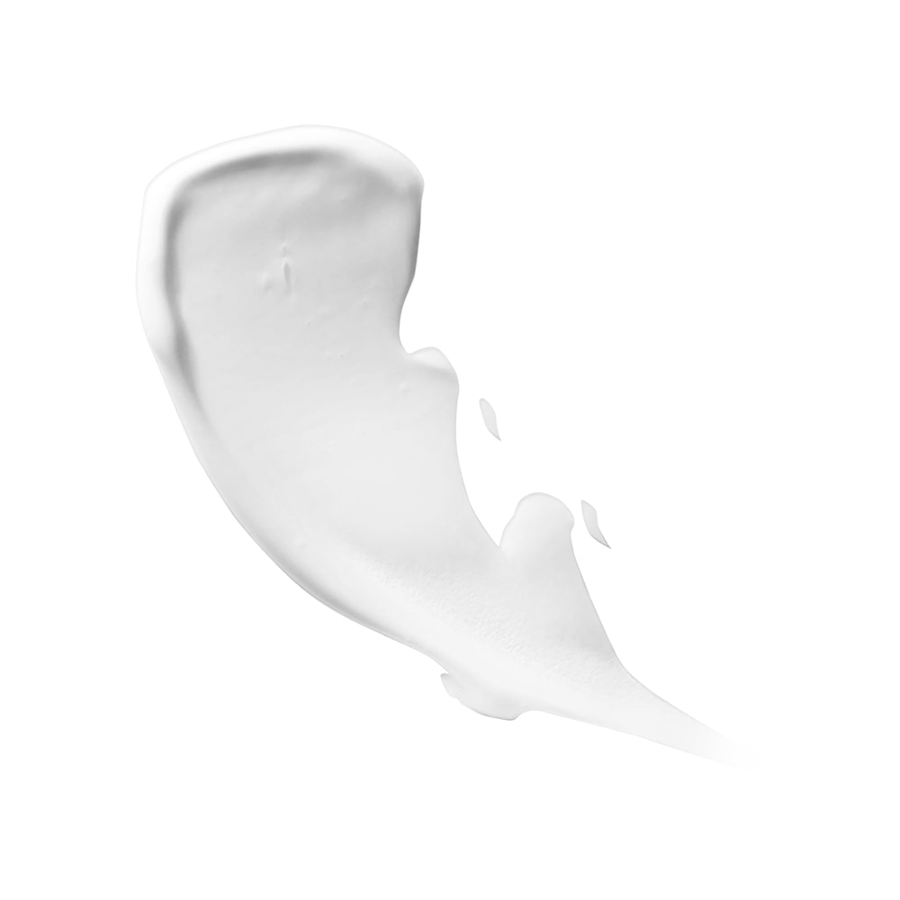 white cream smear with soft edges and subtle shadows on white background