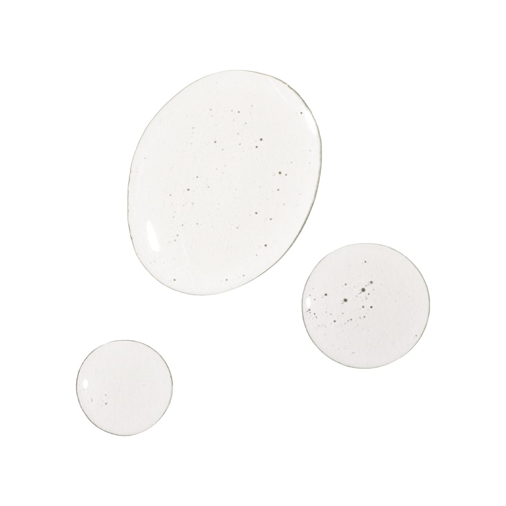 Three clear liquid droplets with small bubbles on a white background